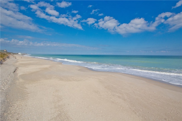 view of water feature with a beach view