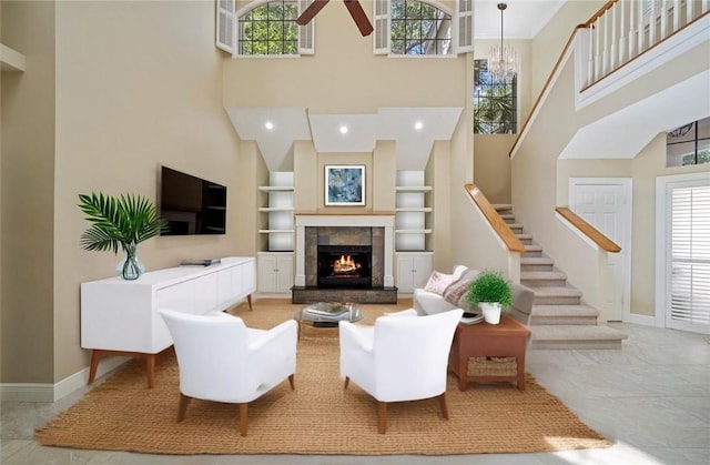1619 Bent Oak Ln, Vero Beach, FL 32963 - living room with built in shelves, a high ceiling, stairway, baseboards, and plenty of natural light