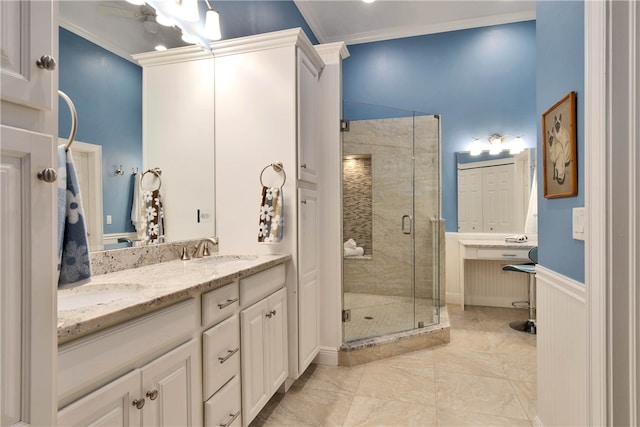 bathroom featuring vanity, crown molding, and walk in shower