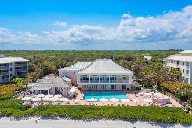 1619 Bent Oak Ln, Vero Beach, FL 32963 - back of house with an outdoor pool, a patio area, a pergola, and a balcony