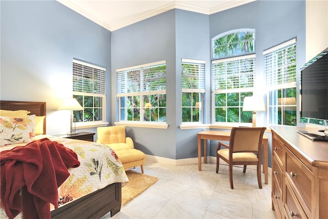 bedroom with multiple windows and crown molding