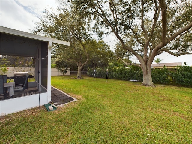 view of yard featuring a sunroom