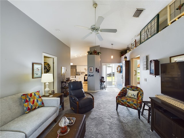 living room featuring carpet flooring, ceiling fan, and lofted ceiling