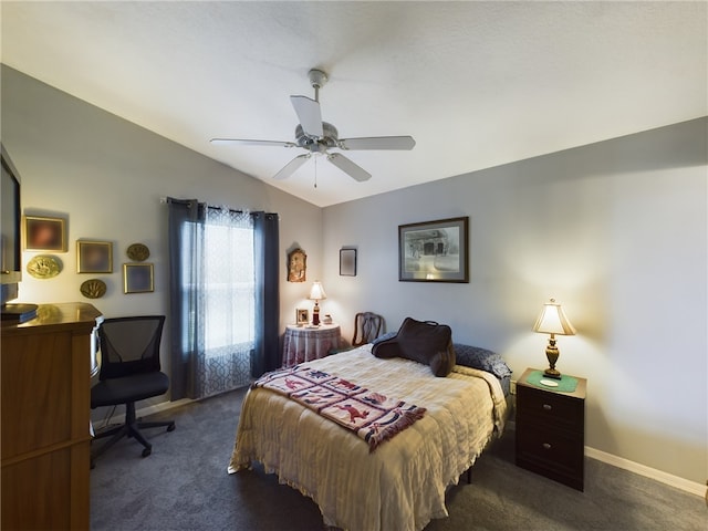 bedroom with dark carpet, vaulted ceiling, and ceiling fan