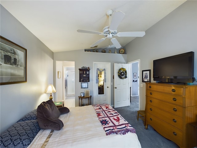 carpeted bedroom with connected bathroom, ceiling fan, and vaulted ceiling