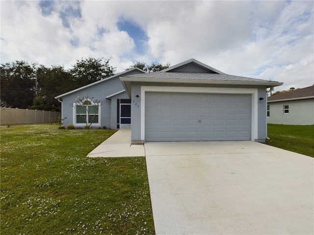 ranch-style house featuring a front yard and a garage