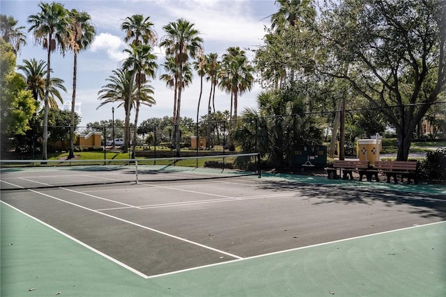 view of tennis court with fence