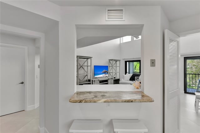 kitchen featuring light tile patterned flooring