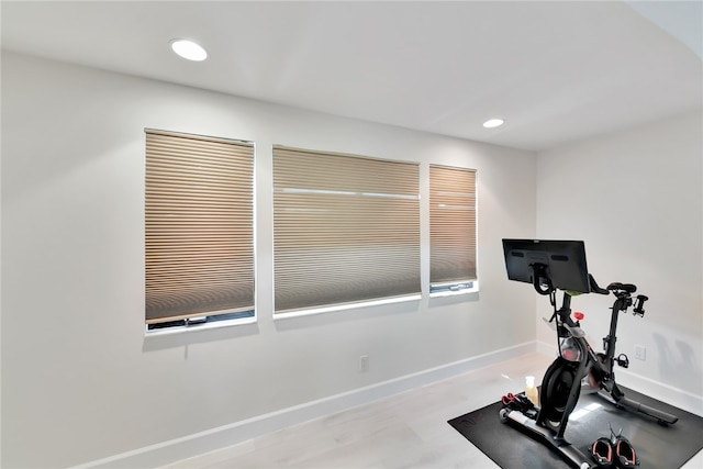 workout area with light wood-type flooring