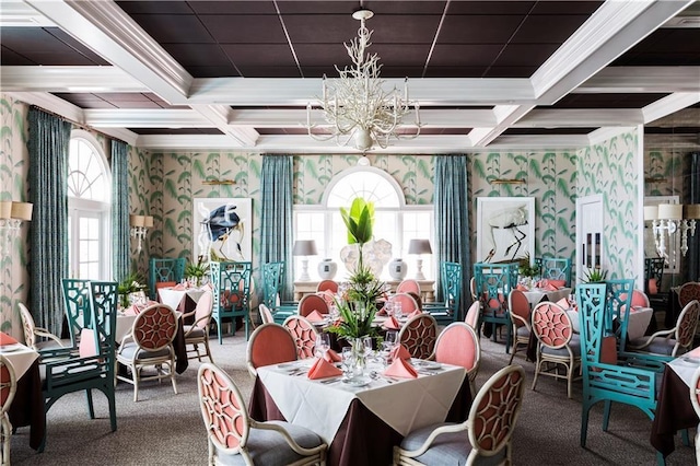 dining room with wallpapered walls, carpet, coffered ceiling, a chandelier, and crown molding