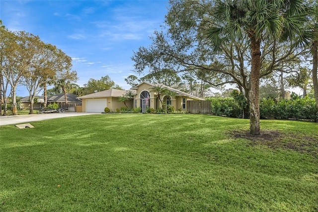 ranch-style home featuring a garage, concrete driveway, fence, a front lawn, and stucco siding