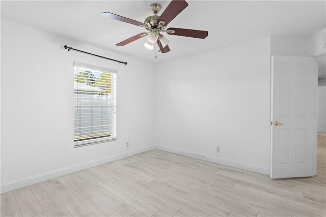 empty room with ceiling fan and light wood-type flooring