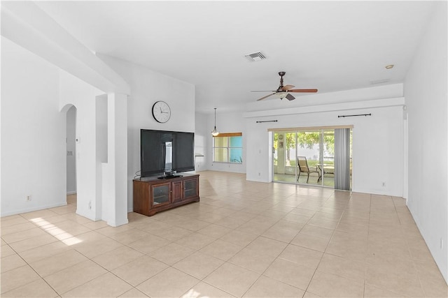 unfurnished living room featuring ceiling fan and light tile patterned floors