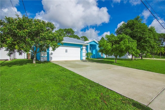 ranch-style home featuring a garage and a front lawn