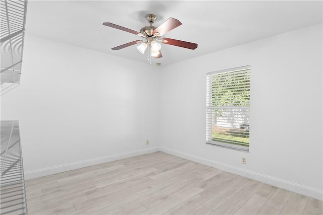 empty room featuring ceiling fan and light hardwood / wood-style floors