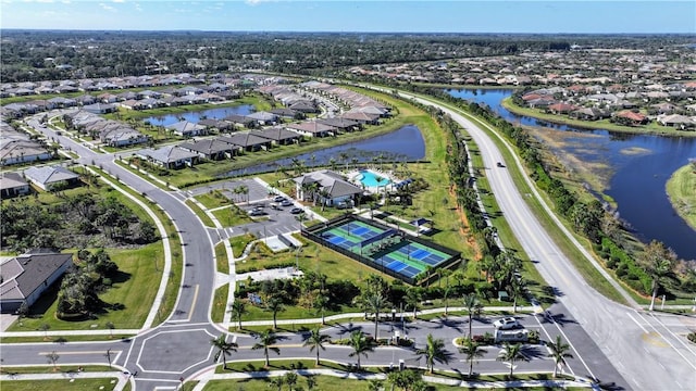 drone / aerial view with a water view and a residential view