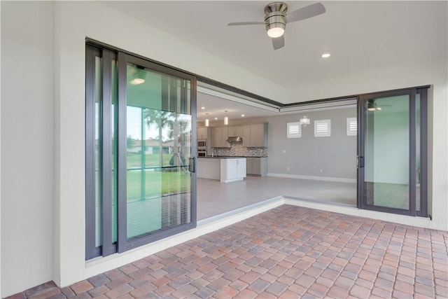 view of patio featuring a sink and a ceiling fan