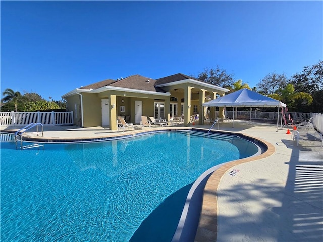 view of swimming pool with a patio