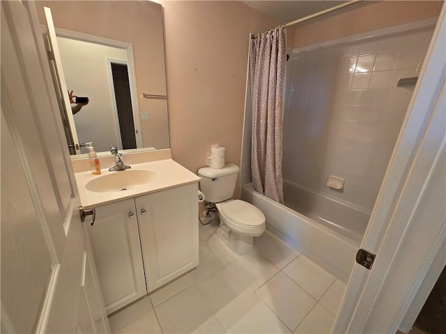 full bathroom with tile patterned floors, vanity, shower / bath combo, and toilet