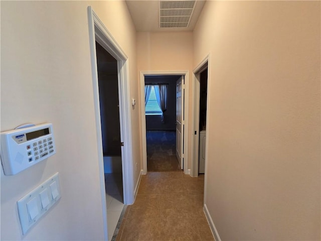 hall with light tile patterned flooring