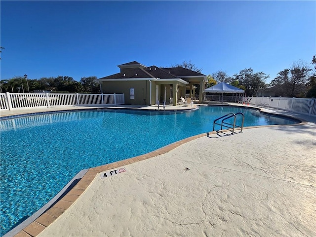 view of swimming pool with a gazebo and a patio area