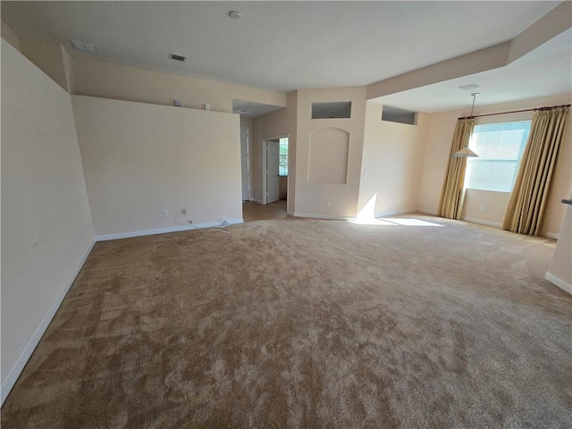 empty room featuring light colored carpet