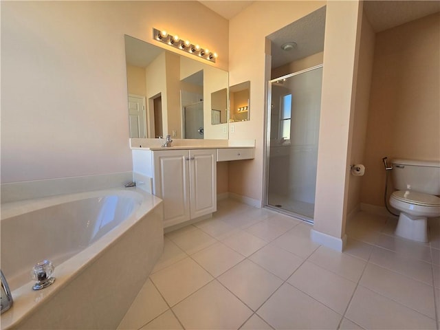 full bathroom featuring tile patterned floors, vanity, shower with separate bathtub, and toilet