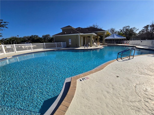 view of swimming pool with a patio