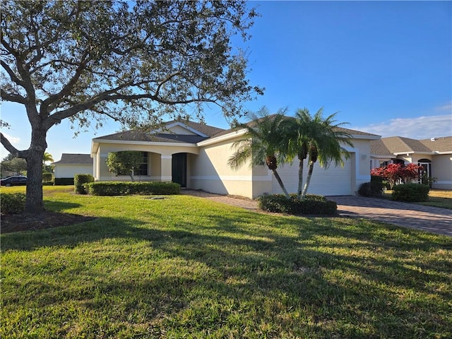 ranch-style home with a front lawn and a garage