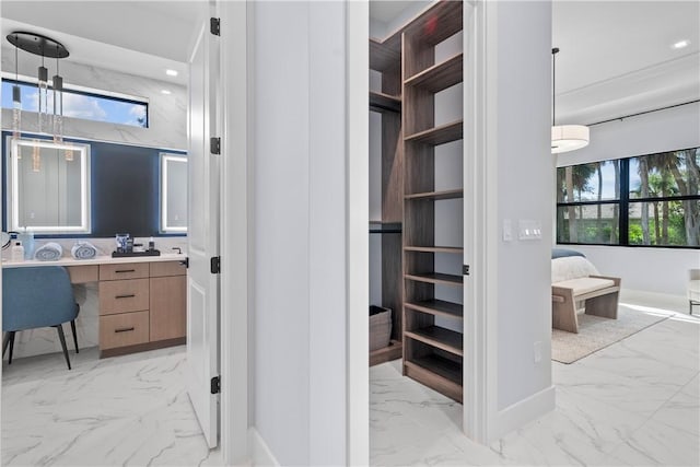 9259 Seaglass Ct, Vero Beach, FL 32963 - spacious closet with light marble finish flooring and built in desk