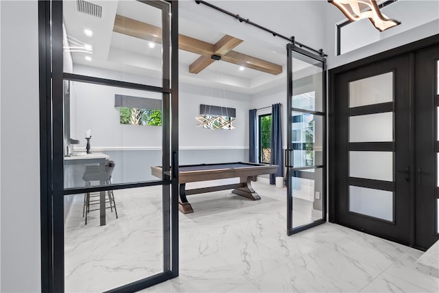 9259 Seaglass Ct, Vero Beach, FL 32963 - foyer entrance featuring pool table, plenty of natural light, light marble finish flooring, coffered ceiling, and recessed lighting