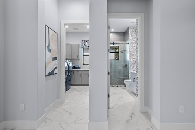 9259 Seaglass Ct, Vero Beach, FL 32963 - hall featuring baseboards and light marble finish floors
