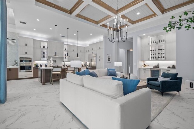 9259 Seaglass Ct, Vero Beach, FL 32963 - living area with light marble finish flooring, bar, recessed lighting, a chandelier, and beam ceiling