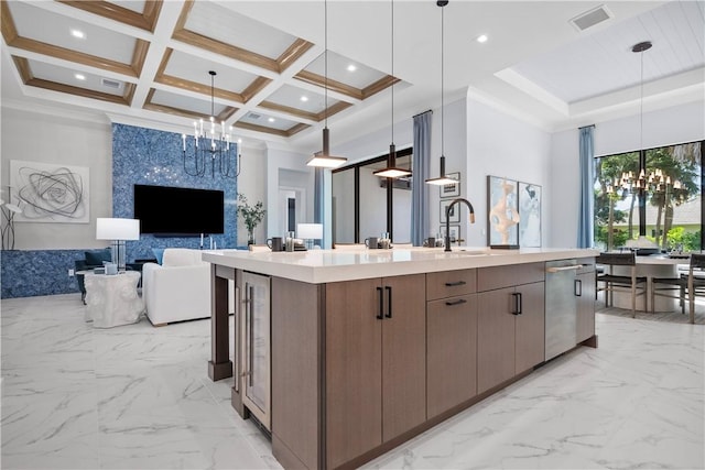 9259 Seaglass Ct, Vero Beach, FL 32963 - kitchen with open floor plan, a chandelier, dishwasher, a center island with sink, and a sink