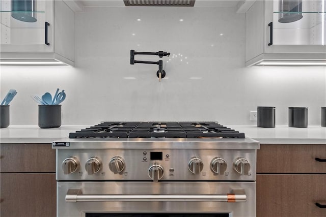 9259 Seaglass Ct, Vero Beach, FL 32963 - kitchen view of stainless steel range with gas stovetop, light countertops, and pot filler