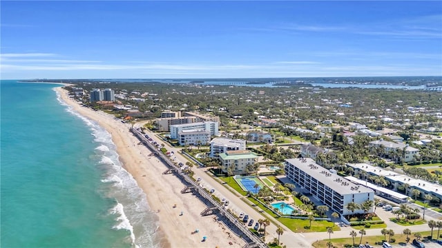 bird's eye view with a beach view and a water view