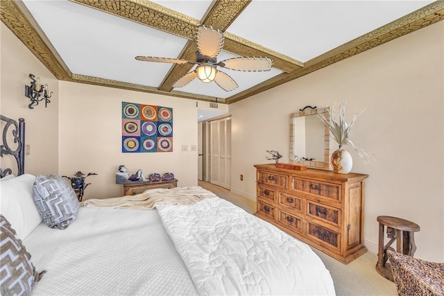 bedroom featuring light colored carpet, ceiling fan, and coffered ceiling