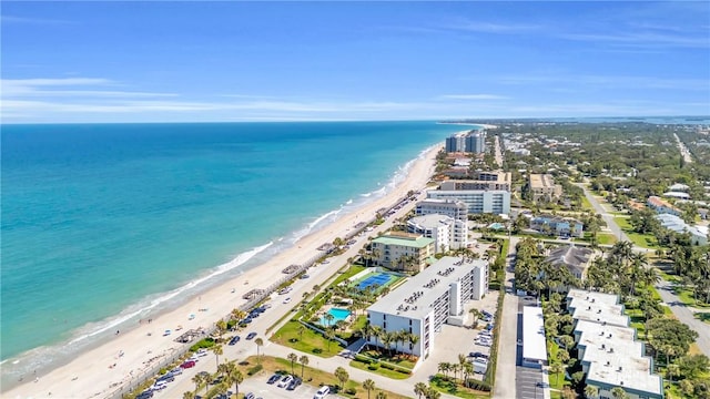 aerial view with a view of the beach and a water view