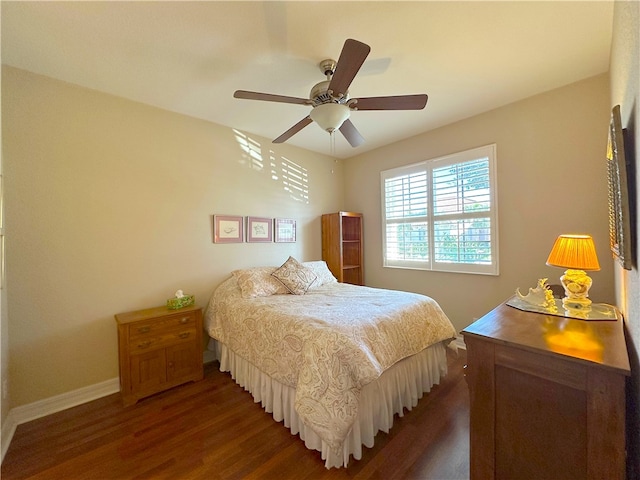 bedroom with ceiling fan and dark wood-type flooring