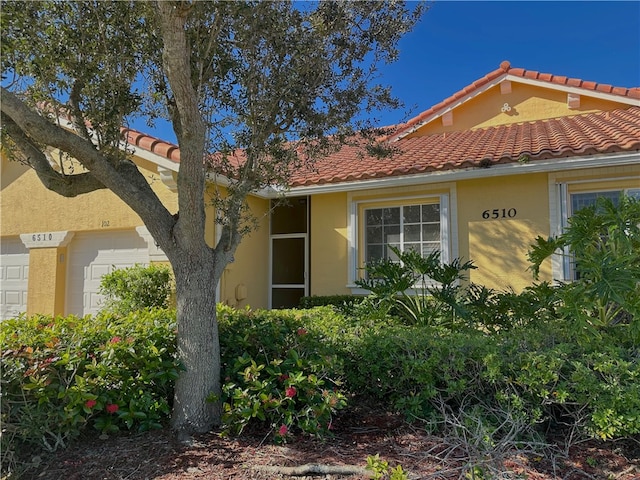 view of property exterior featuring a garage