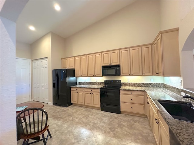 kitchen with light brown cabinetry, sink, high vaulted ceiling, and black appliances