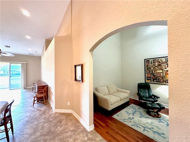 interior space featuring ceiling fan and hardwood / wood-style flooring