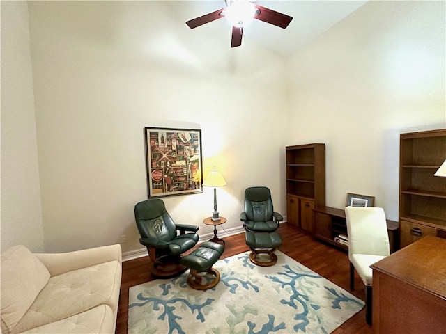 office area with dark hardwood / wood-style floors, vaulted ceiling, and ceiling fan