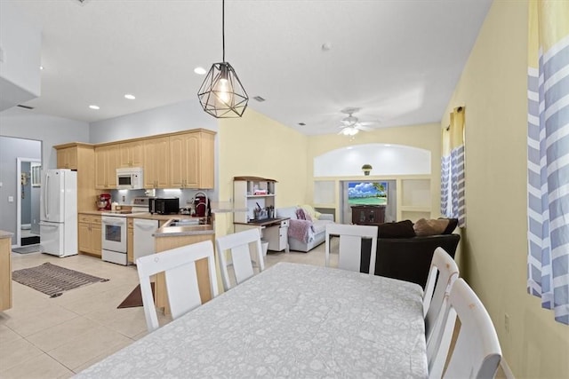 dining area with sink, ceiling fan, and light tile patterned floors