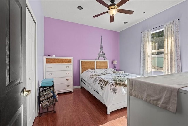 bedroom featuring ceiling fan and dark hardwood / wood-style floors