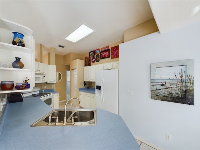 kitchen featuring white cabinets, white appliances, and sink