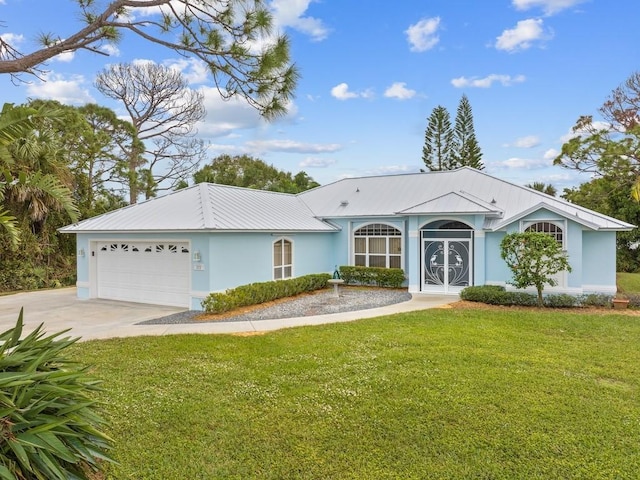 ranch-style house with a garage and a front yard