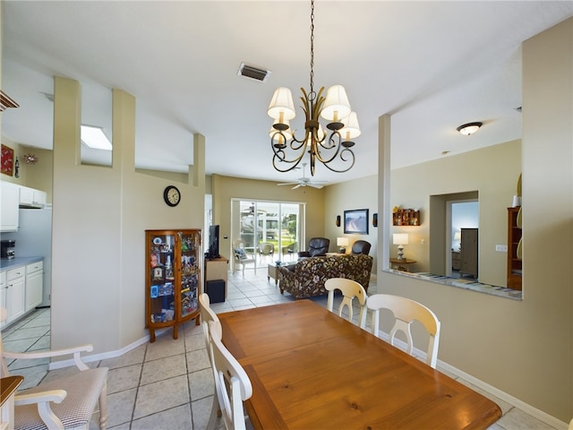 dining area with a notable chandelier and light tile patterned flooring