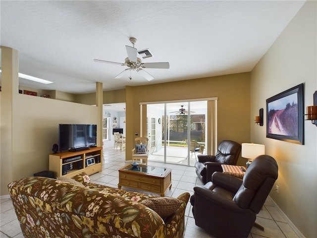 tiled living room featuring ceiling fan