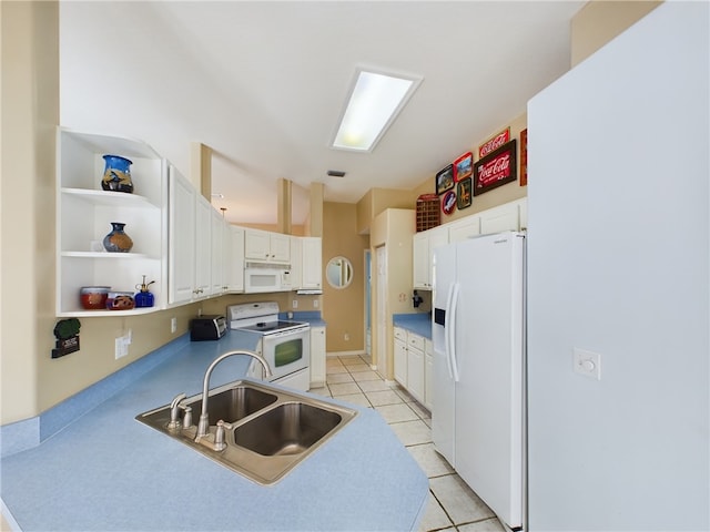 kitchen with white cabinetry, sink, light tile patterned floors, and white appliances